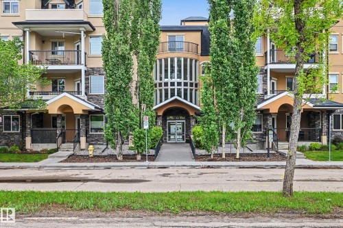 Multi-story residential building featuring a stone and stucco facade - 402 8730 82 Avenue, Edmonton, AB 