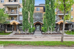 Multi-story residential building featuring a stone and stucco facade - 
