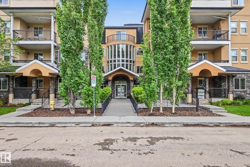 Multi-story building with a stucco and stone veneer exterior - 402 8730 82 Avenue, Edmonton, AB 