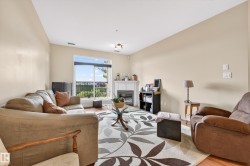 Living area with light beige walls and sloped ceilings - 