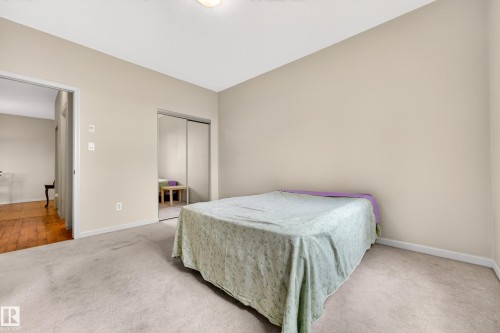 Carpeted room with neutral wall tones and a ceiling-mounted light fixture - 133 2503 Hanna Crescent, Edmonton, AB 