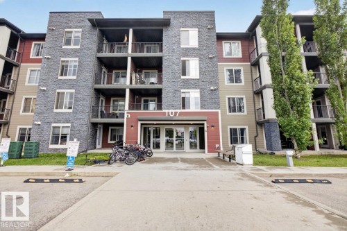 Contemporary multi-story building featuring a stone and siding exterior - 101 107 Watt Common, Edmonton, AB 
