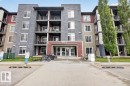 Contemporary multi-story building featuring a stone and siding exterior - 101 107 Watt Common, Edmonton, AB 
