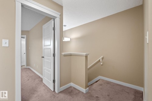 Carpeted hallway with painted walls and white trim - 12809 203A, Edmonton, AB 