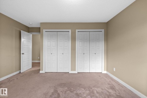 Neutral-toned wall paint and plush carpeting create a comfortable atmosphere - 12809 203A, Edmonton, AB 