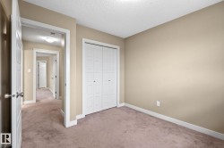 Carpeted room with neutral-toned walls - 