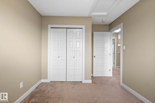 Warm beige wall tones complement neutral carpeting - 12809 203A, Edmonton, AB 