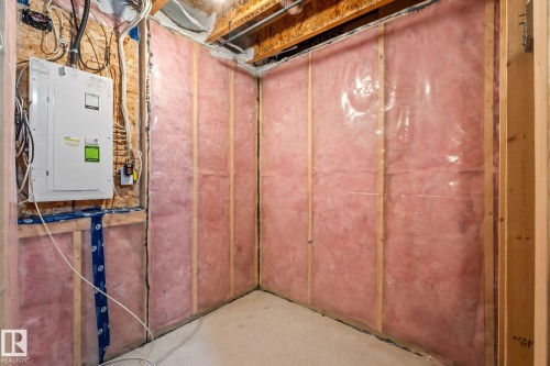 Unfinished basement area featuring framed walls with insulation and vapor barrier, exposed ceiling joists, and a concrete floor - 12809 203A, Edmonton, AB 