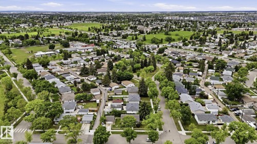 Aerial depiction of a residential area with extensive green spaces and mature tree canopies - 13008 105 Street Nw, Edmonton, AB 