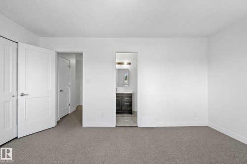 Spacious room with new carpeting, white walls, and bright white trim - 2832 135 Avenue, Edmonton, AB - Indoor