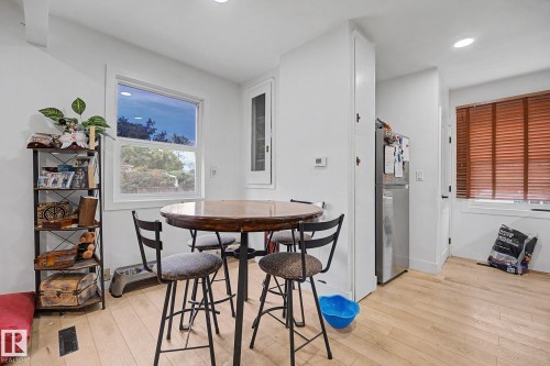 Dining area with light wood-finish flooring - 11914 124 Street, Edmonton, AB 