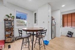 Dining area with light wood-finish flooring - 