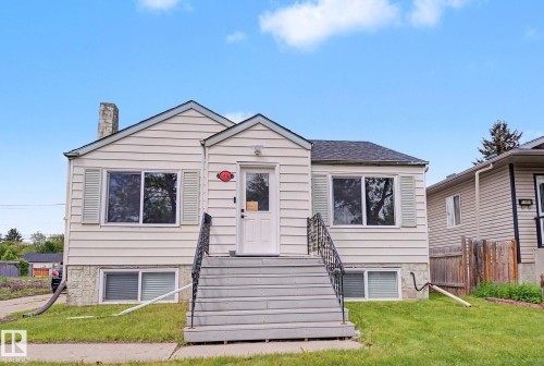 Traditional exterior with horizontal siding and a stone foundation - 11914 124 Street, Edmonton, AB 