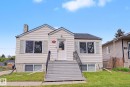 Traditional exterior with horizontal siding and a stone foundation - 11914 124 Street, Edmonton, AB 