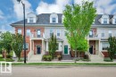 Multi-story townhouse exterior featuring brick and siding finishes - 14 4367 Veterans Way, Edmonton, AB 
