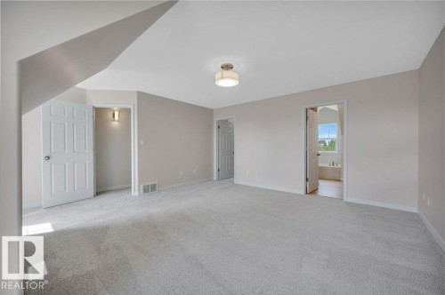 Spacious room with neutral wall tones - 14 4367 Veterans Way, Edmonton, AB 