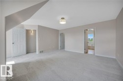 Spacious room with neutral wall tones - 