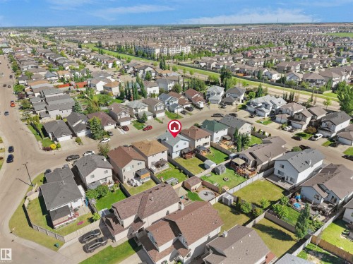 Aerial perspective showcasing a residential neighborhood with numerous detached homes - 2418 32B Street, Edmonton, AB 