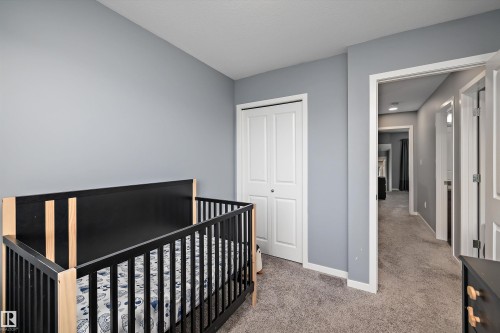 Room featuring light gray painted walls and neutral carpet flooring - 2833 Chokecherry Place, Edmonton, AB 