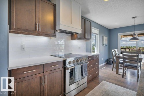 482 Reed Cres Leduc AB. Quartz counter with motion sensor under cabinet lighting - 482 Reed Crescent, Leduc, AB 