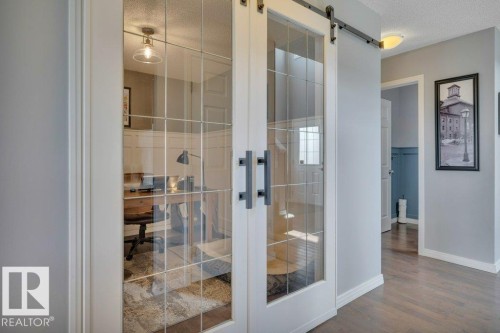 482 Reed Cres Leduc AB. Custom wainscoting and French doors. - 482 Reed Crescent, Leduc, AB 