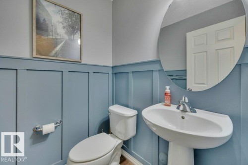 482 Reed Cres Leduc AB. Main floor 2 pc bathroom with custom wainscoting. - 482 Reed Crescent, Leduc, AB 