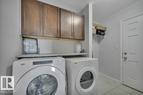 482 Reed Cres Leduc AB. Folding counter with storage above. Sliding barn door with motion señor lighting. Access to garage. - 482 Reed Crescent, Leduc, AB 
