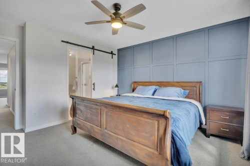 482 Reed Cres Leduc, AB . Barn doors on 4 pc  primary ensuite - 482 Reed Crescent, Leduc, AB 