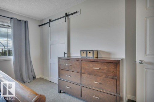 482 Reed Cres Leduc, AB . Barn doors on walk in closet . - 482 Reed Crescent, Leduc, AB 