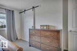 482 Reed Cres Leduc, AB . Barn doors on walk in closet . - 