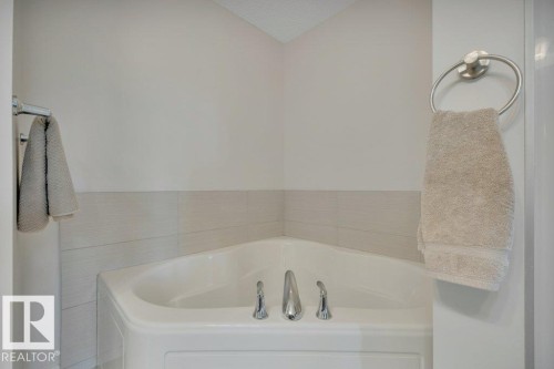 482 Reed Cres Leduc, AB . Soaker tub with 50 gallon hot water tank installed 2023. - 482 Reed Crescent, Leduc, AB 