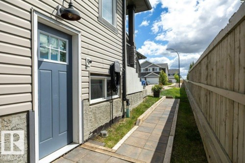 482 Reed Cres Leduc, AB . Outside access door with gate access to back yard. - 482 Reed Crescent, Leduc, AB 