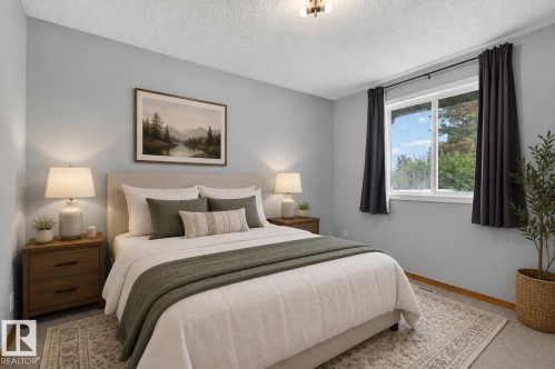 Spacious bedroom featuring light gray walls and plush carpeting - 13427 114 Street, Edmonton, AB 