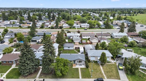 Residential neighborhood featuring established homes, mature trees, and a visible road network - 13427 114 Street, Edmonton, AB 