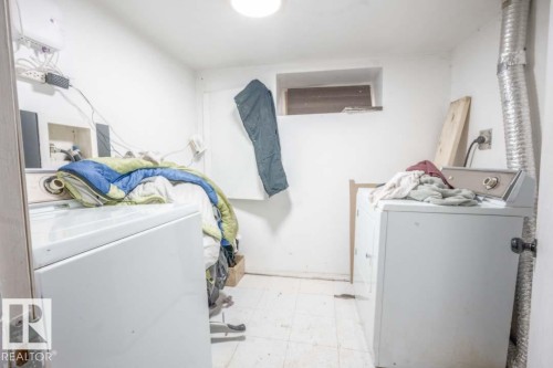 Utility room featuring a window opening, overhead lighting, and white walls - 11308 94 Street, Edmonton, AB 