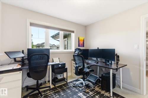 Room featuring neutral wall tones, white trim, and a window with blinds - 3685 Westcliff Way, Edmonton, AB 