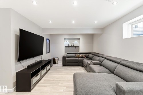 Recessed lighting illuminating a spacious room with light wood-finish flooring - 3685 Westcliff Way, Edmonton, AB 
