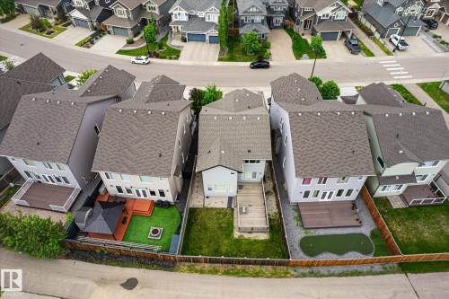 Aerial perspective showcasing residential properties with pitched shingle roofs and fenced backyards - 3685 Westcliff Way, Edmonton, AB 