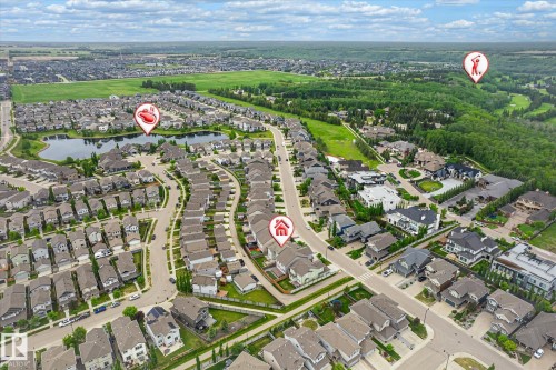 Aerial perspective of a residential community featuring diverse housing styles, curvilinear streets, and extensive green spaces - 3685 Westcliff Way, Edmonton, AB 