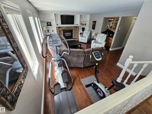 Large Main Floor Family Room w/ Wet Bar, Fireplace and large windows. - 15 Paquette Place, St. Albert, AB 