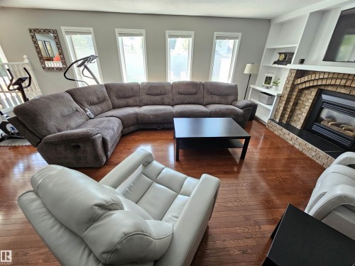 Large Main Floor Family Room w/ Wet Bar, Fireplace and lots of natural light. - 15 Paquette Place, St. Albert, AB 