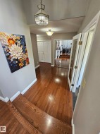 Wide front entry area, leads to main floor office/den/bedroom - 