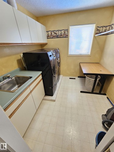 Upper Level (2nd Floor) Laundry w/ Sink and Storage - 15 Paquette Place, St. Albert, AB 