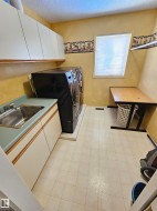 Upper Level (2nd Floor) Laundry w/ Sink and Storage - 