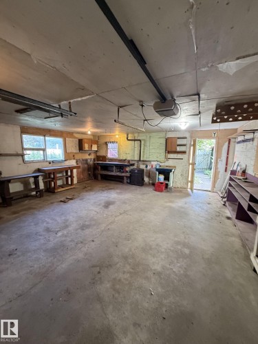 Concrete flooring provides a durable base for this versatile space - 16321 - 109A Ave, Edmonton, AB - Indoor Photo Showing Garage