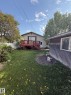 Rear exterior with a red-stained wood deck and staircase - 16321 - 109A Ave, Edmonton, AB  - Outdoor With Deck Patio Veranda 