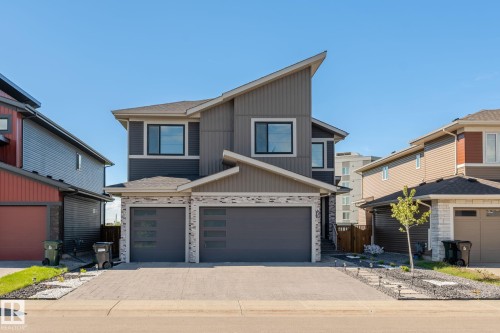 Contemporary facade featuring a split-level roofline and mixed material siding - 23 Elwyck Gate, Spruce Grove, AB 