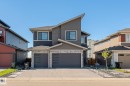 Contemporary facade featuring a split-level roofline and mixed material siding - 23 Elwyck Gate, Spruce Grove, AB 