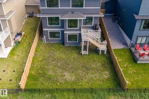 Contemporary multi-story exterior with dark gray siding and white trim - 23 Elwyck Gate, Spruce Grove, AB 