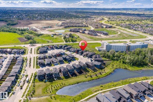 Aerial perspective showcasing a modern residential community with diverse architectural styles - 23 Elwyck Gate, Spruce Grove, AB 